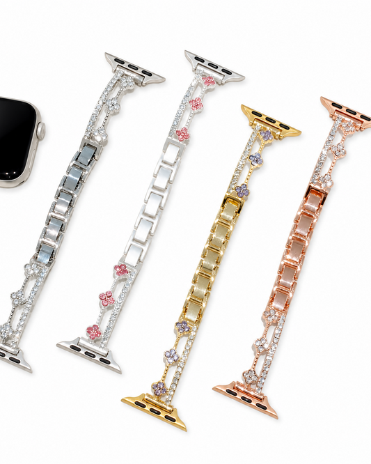 Silver, gold, and rose-tone flower link watch bands with rectangular bracelet links and decorative accent rails.