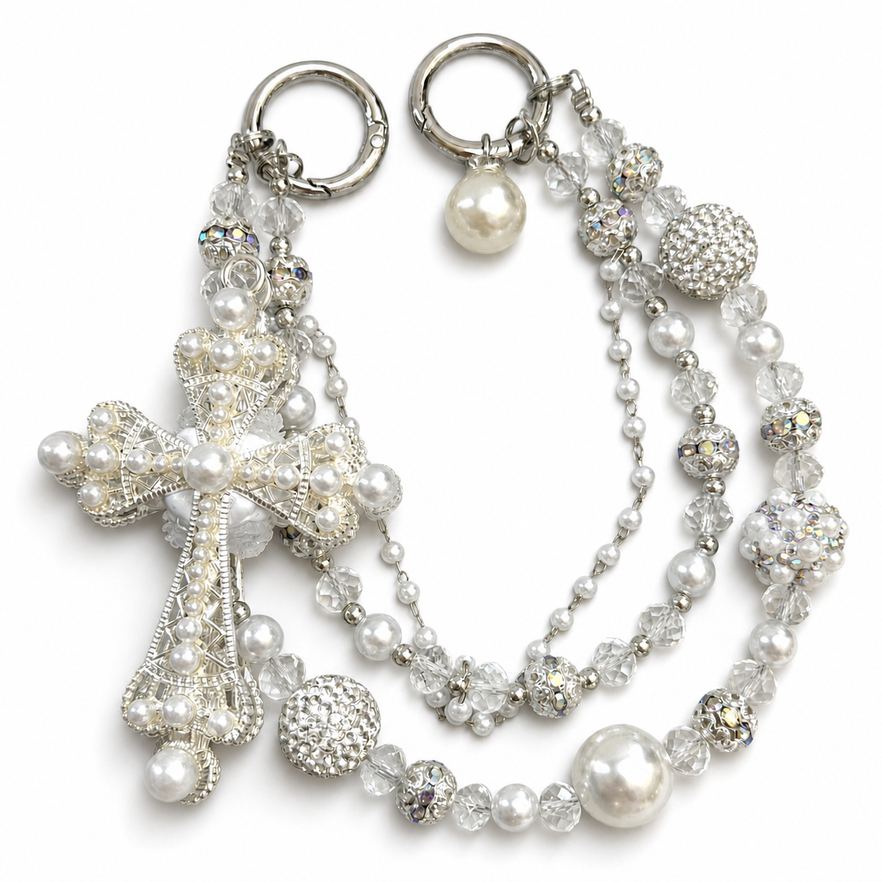 White and clear beaded bag charm with a large pearl-inspired cross centerpiece.